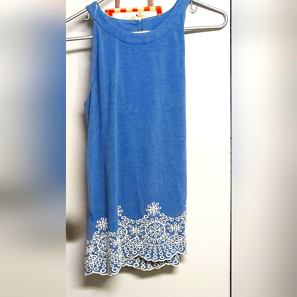 Adriana Papell size medium, and it's more of an azure blue with hand stiching